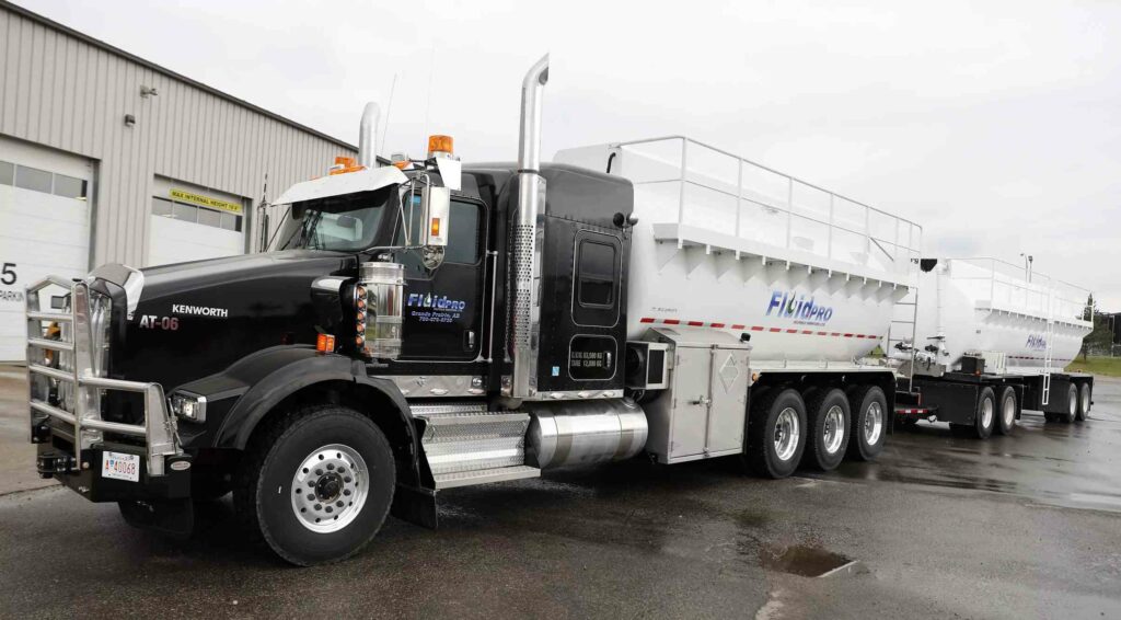 FluidPRO acid truck in Alberta oilfield, Front & Left Side Shot